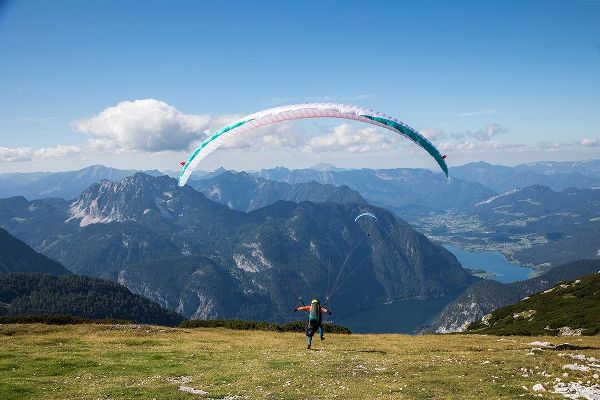 Austria-Dachstein-Paragliders as they prepare to take off above Lake Hallstatt